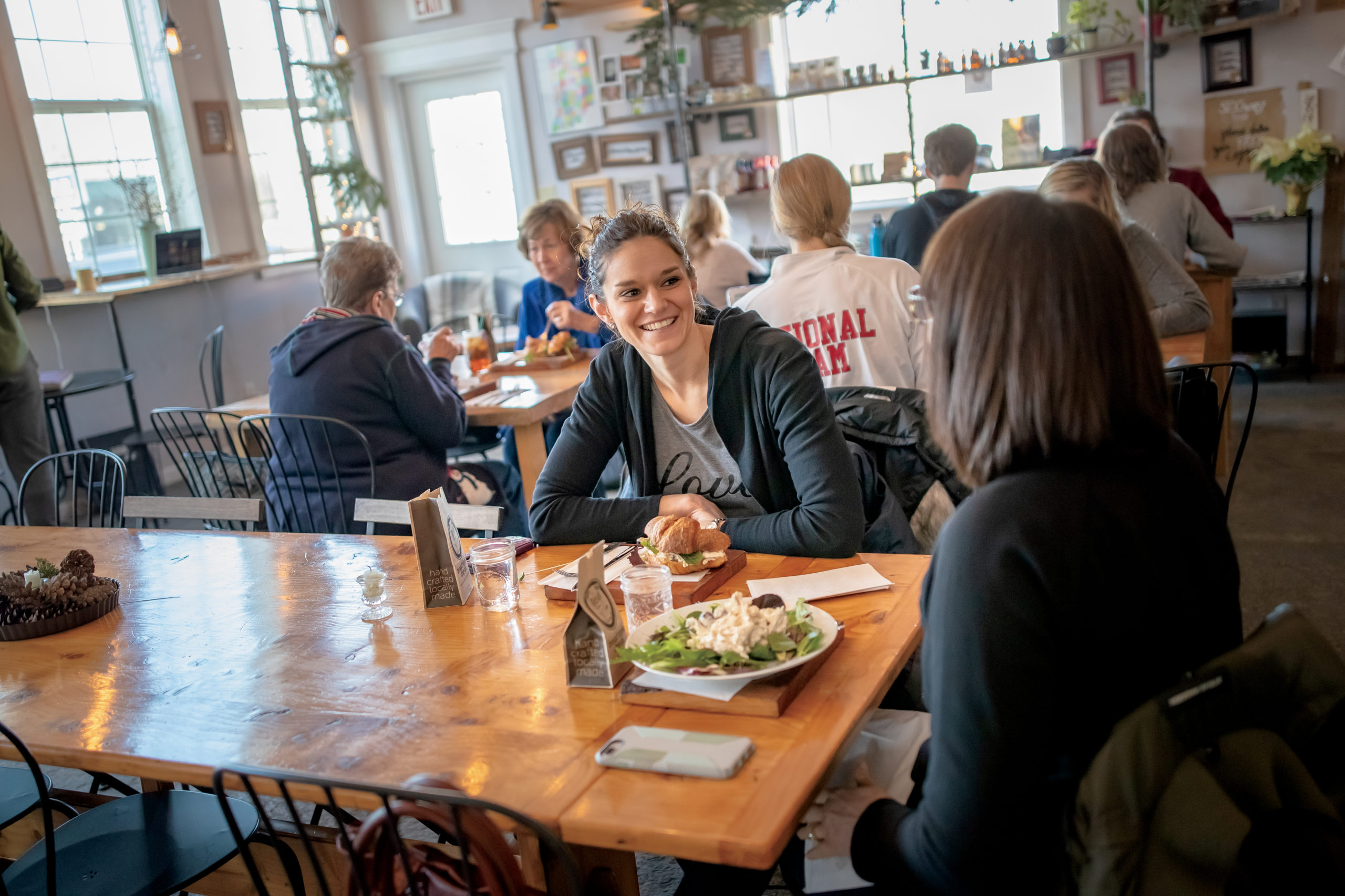 Customers talking and enjoying lunch at The Bridge Café in Upland, Indiana