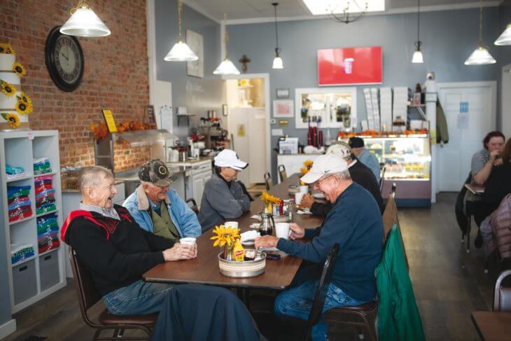 Randall Miller, Morris Lewman and Tom Haase are talking and lauging while having coffee at The Burch Tree Cafe and Bakery in downtown Knightstown, Indiana