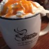 Cup of coffee with whipped cream and caramel at Common Grounds in Hartford City, Indiana