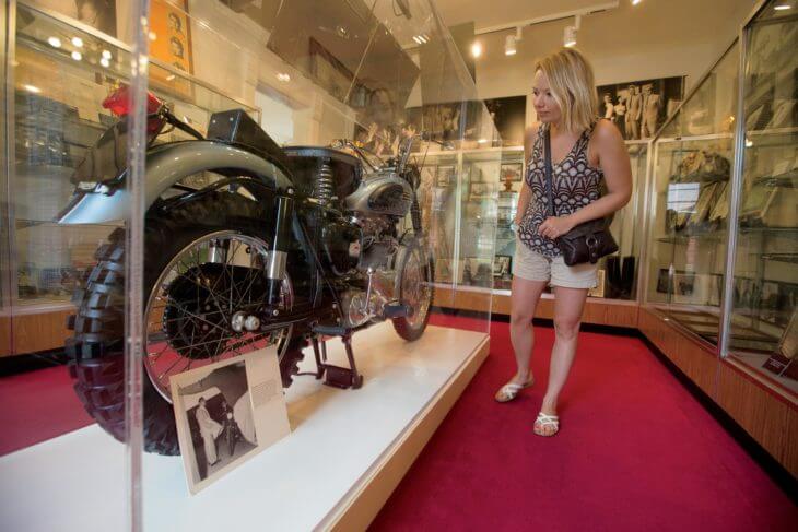 Woman looking at car at Fairmount Historical Museum