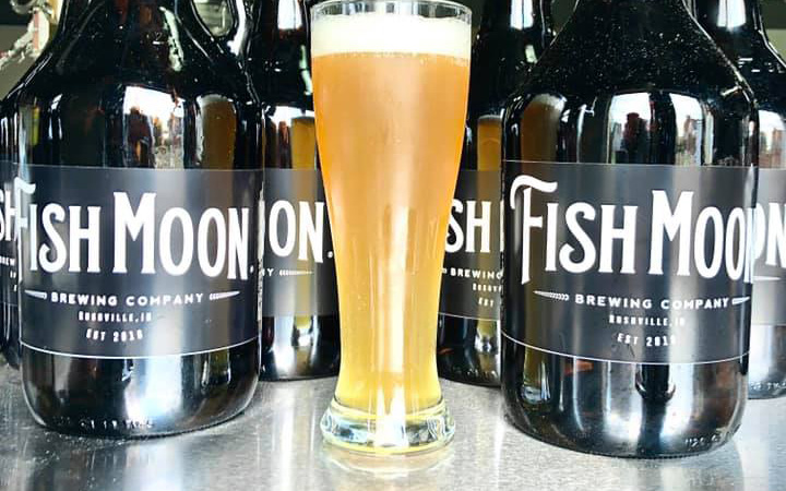 Growlers and a glass of beer from Fish Moon Brewing Company in Rushville, Indiana