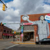 Mural of Wendell Willkie on the side of a brick pharmacy in Rushville, Indiana