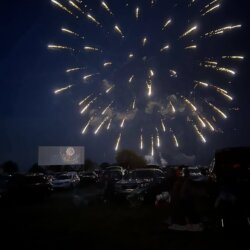 Fireworks light up the night sky above Hummel Drive-In as families gather from their cars to enjoy a classic movie experience under the stars.